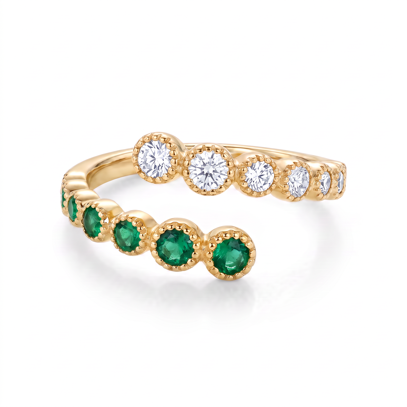 14K yellow gold emerald and diamond bypass ring featuring 0.25ctw emeralds and 0.20ctw diamonds by Raymond Mazza.