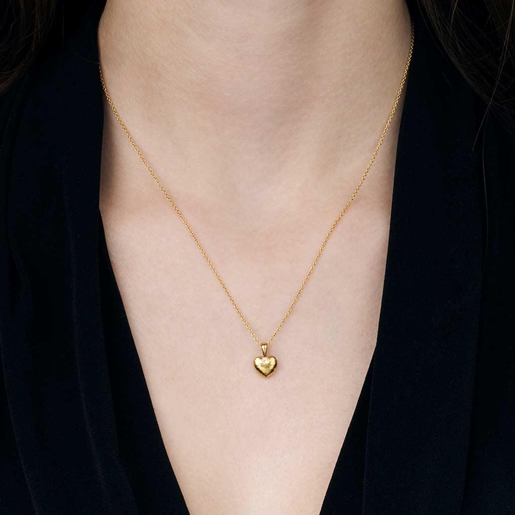 Gurhan Romance heart 24k yellow gold necklace on neck at Victoria Jones Jewelry Amarillo