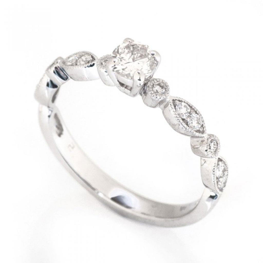diamond white gold promise ring with milgrain details