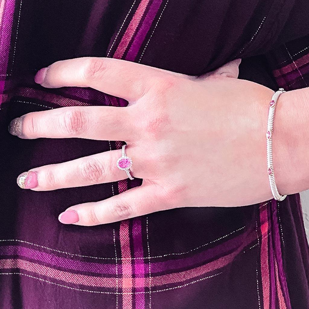 Pink sapphire ring and bracelet on model at Victoria Jones Jewelry