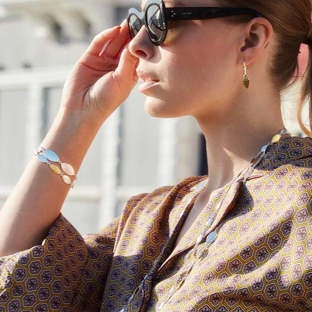 Gurhan Willow Flake bracelets and earrings on model at Victoria Jones Jewelry