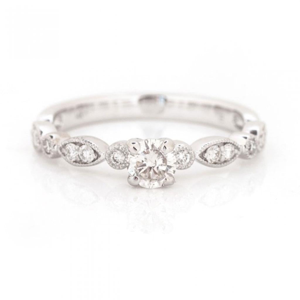 diamond white gold promise ring with milgrain details