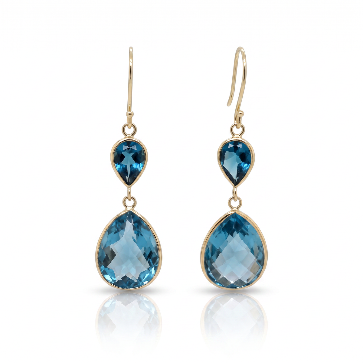 Raymond Mazza pear-shaped Swiss blue topaz drop earrings in 14K yellow gold with shepherd hook closures.