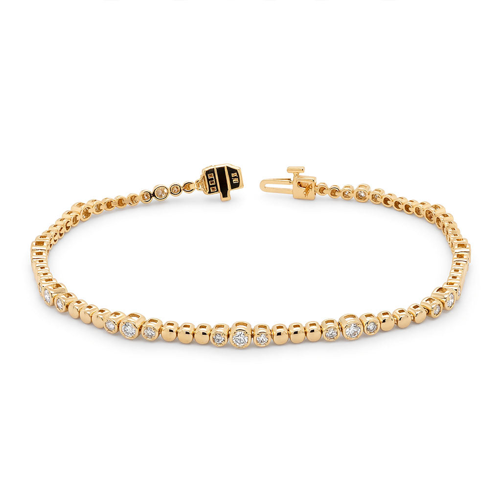Beaded diamond bracelet in 14K yellow gold with polished gold beads and 1.11ctw round diamond accents.