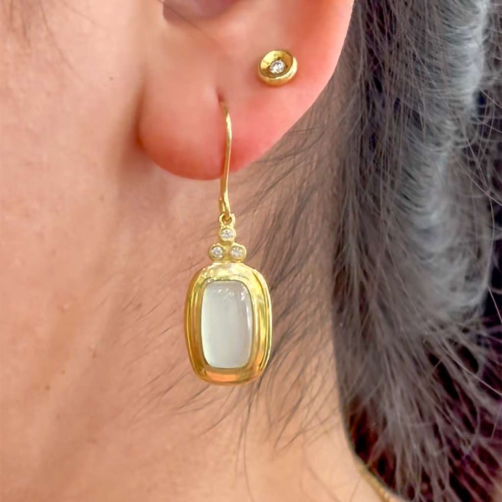 14K yellow gold aquamarine and diamond dangle earrings featuring rectangular cabochon aquamarines, six round diamonds, and shepherd hook by Raymond Mazza