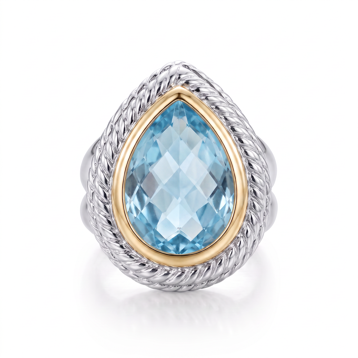 Raymond Mazza two-tone ring with a pear-shaped blue topaz set in sterling silver and 14K yellow gold.