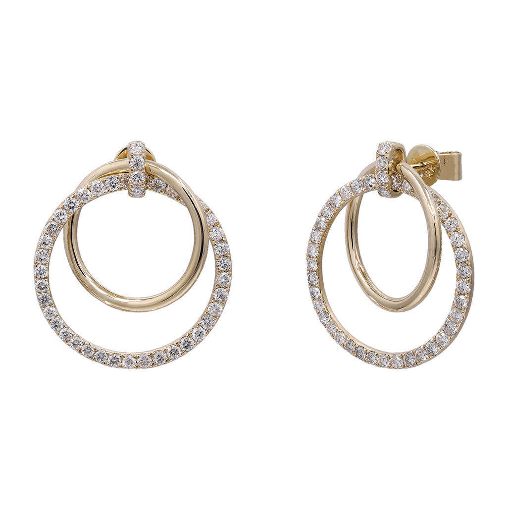 Large diamond hoop earrings with double circle design in yellow gold and pavé diamond detail