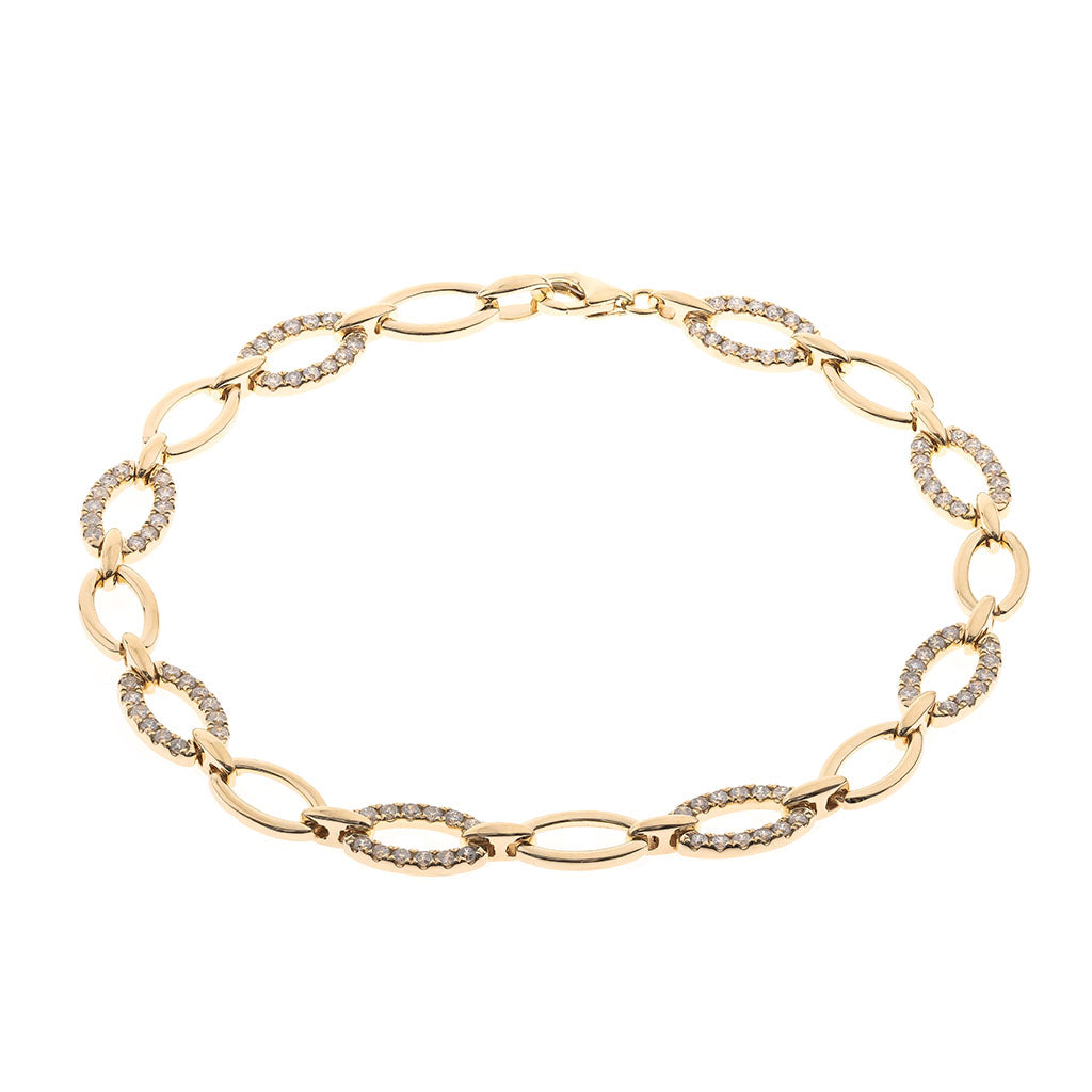 Gold bracelet with interlocking oval links with alternating diamond stations