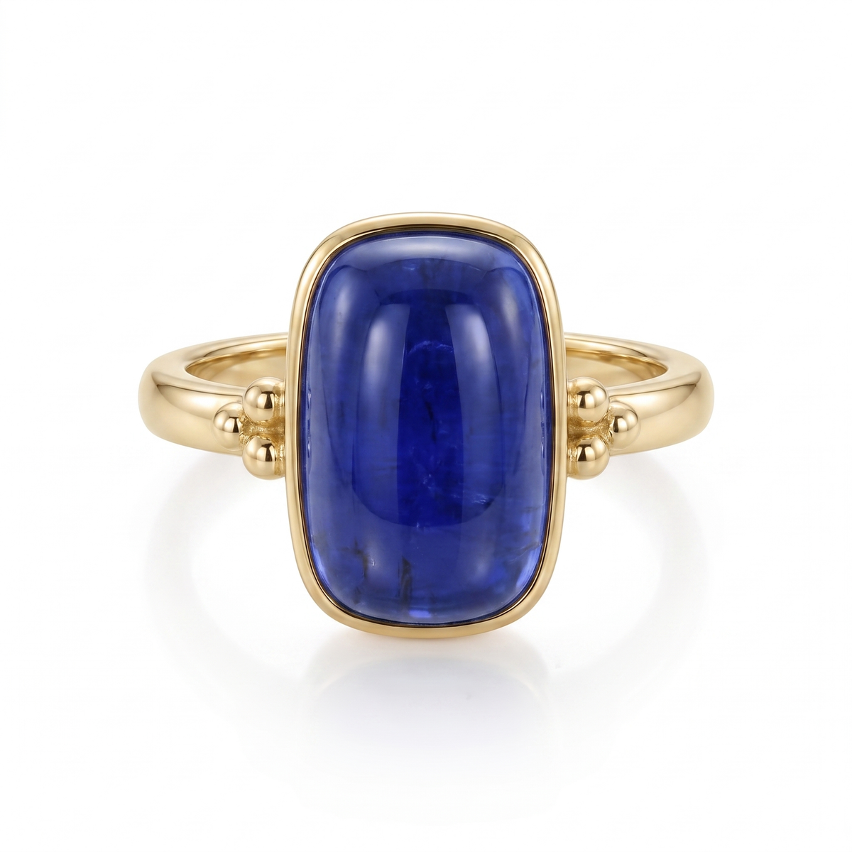 14K yellow gold tanzanite cabochon ring with polished gold bead accents by Raymond Mazza.