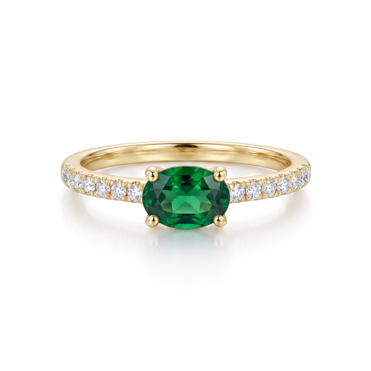 14K yellow gold oval diopside ring featuring a vivid green center stone and diamond-accented shank by Raymond Mazza.