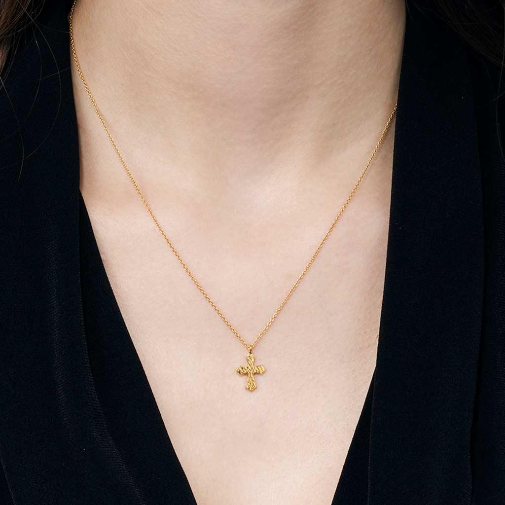 Gurhan 24k Yellow Gold Cross necklace on neck at Victoria Jones Jewelry Amarillo