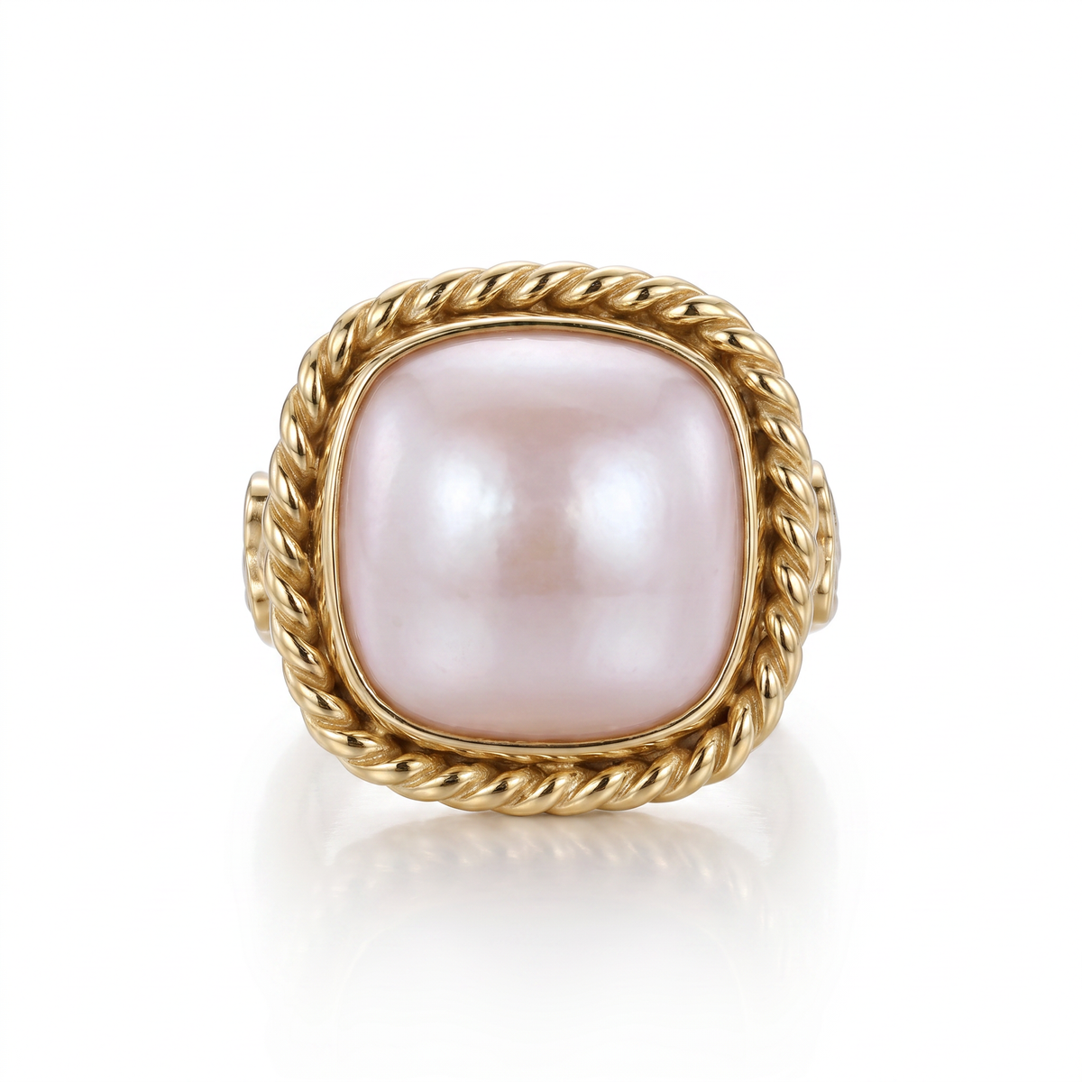 14K yellow gold mabe pearl ring with a diamond-accented rope bezel and rope-textured shank by Raymond Mazza