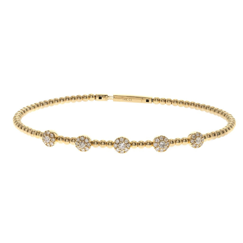 Diamond halo station bracelet in yellow gold at Victoria Jones Jewelry