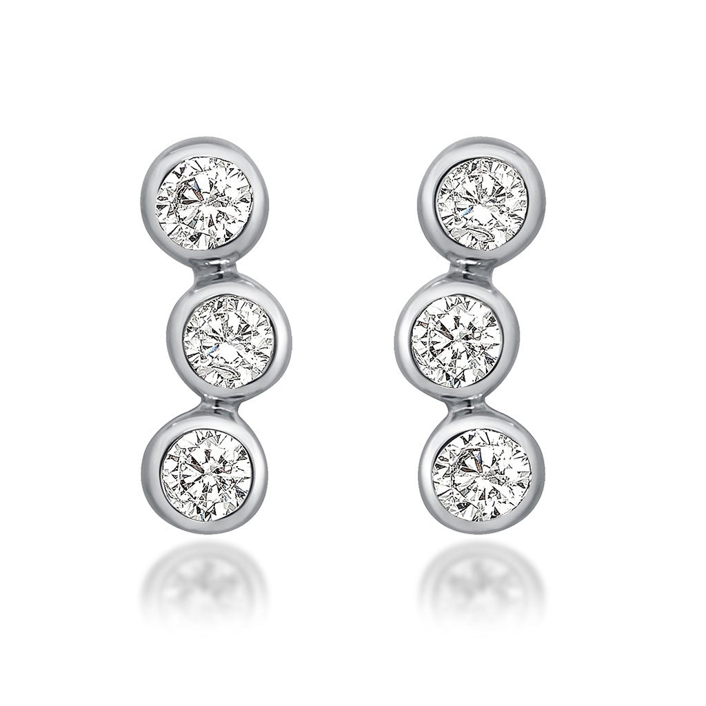 bezel white gold triple diamond earrings at Victoria Jones Jewelry