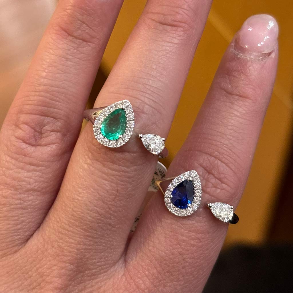 Blue sapphire and diamond halo open pear ring in white gold at Victoria Jones Jewelry