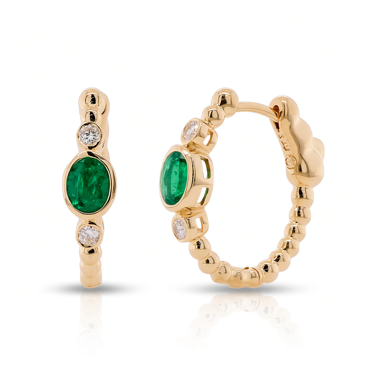 14K yellow gold beaded hoop earrings featuring oval emeralds and round diamond accents.