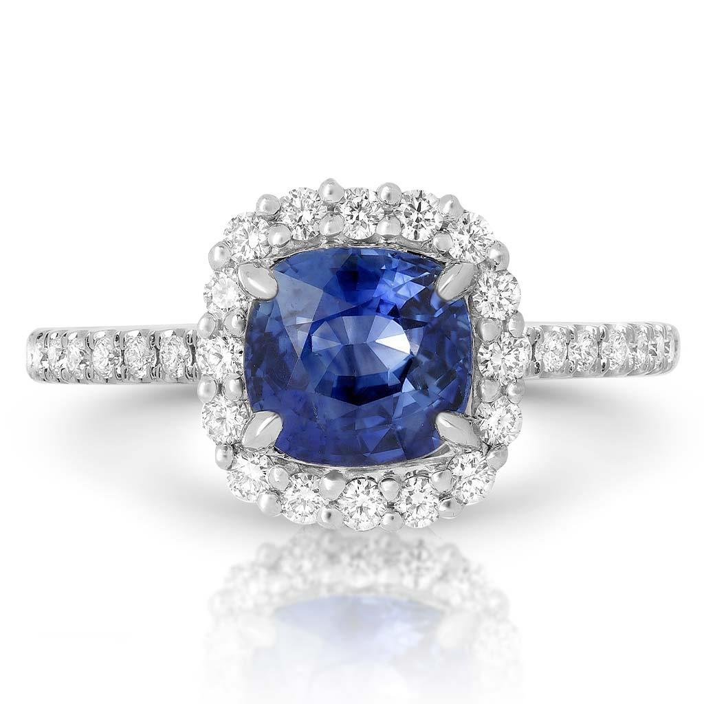 Cushion blue sapphire and diamond halo ring at Victoria Jones