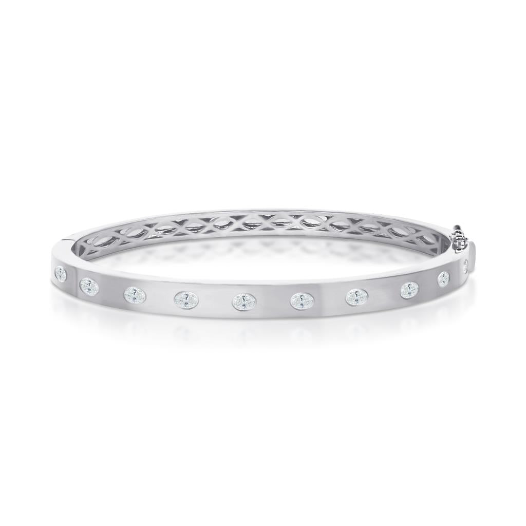 Oval diamond bezel set white gold bangle bracelet