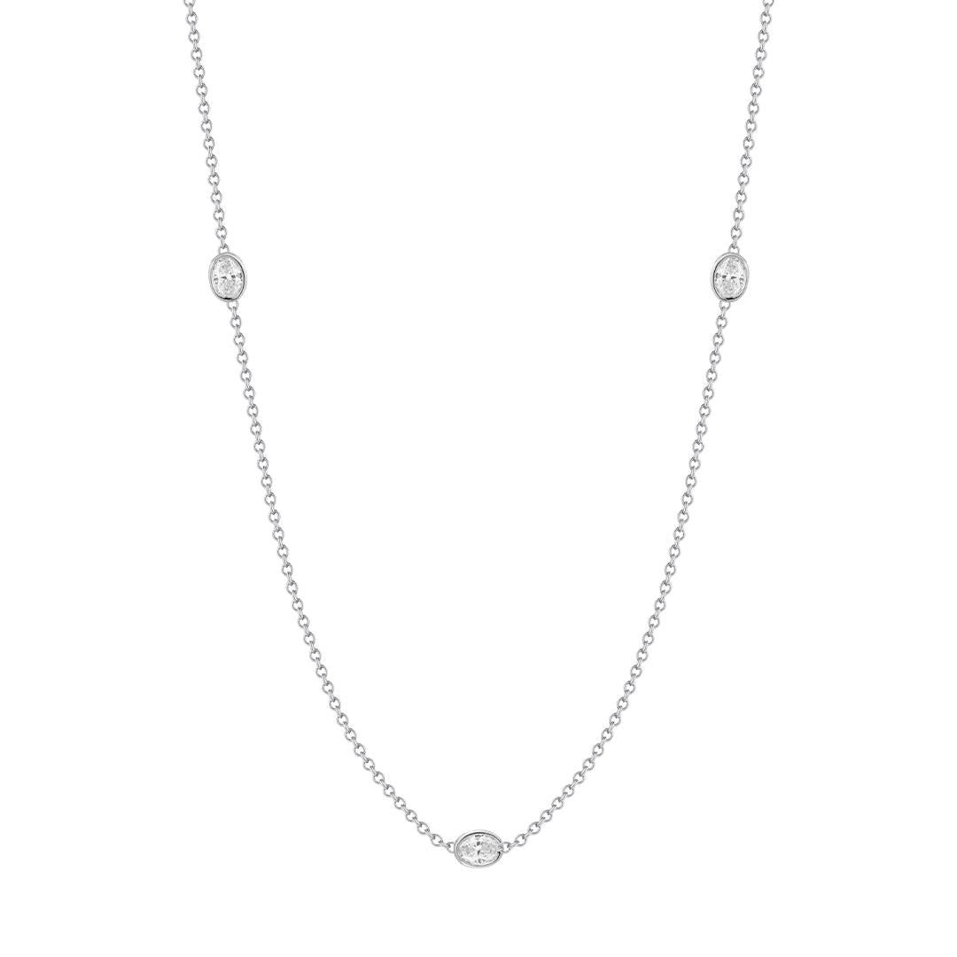 Oval diamond by the yard bezel set necklace in white gold