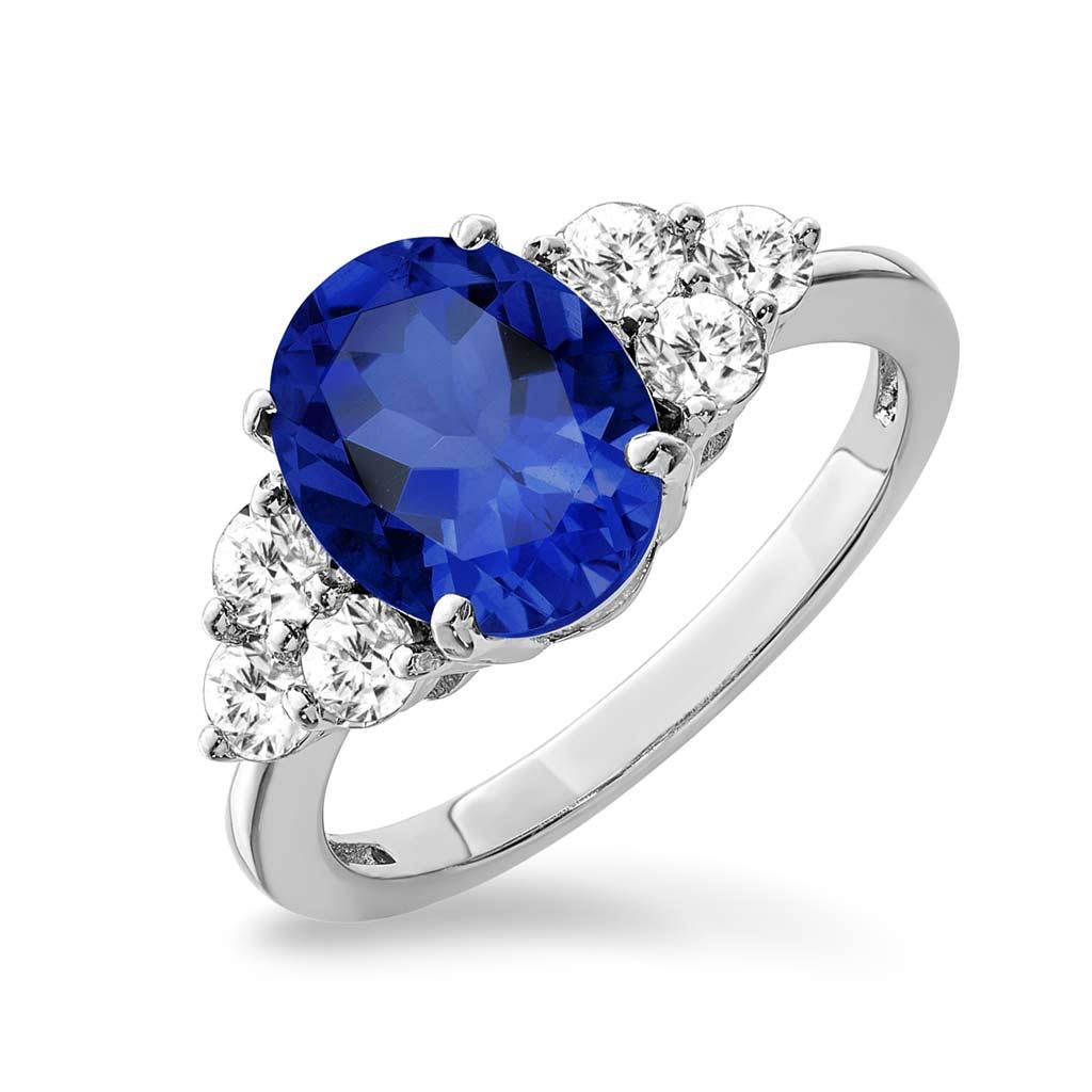 Blue sapphire oval and diamond sides in white gold